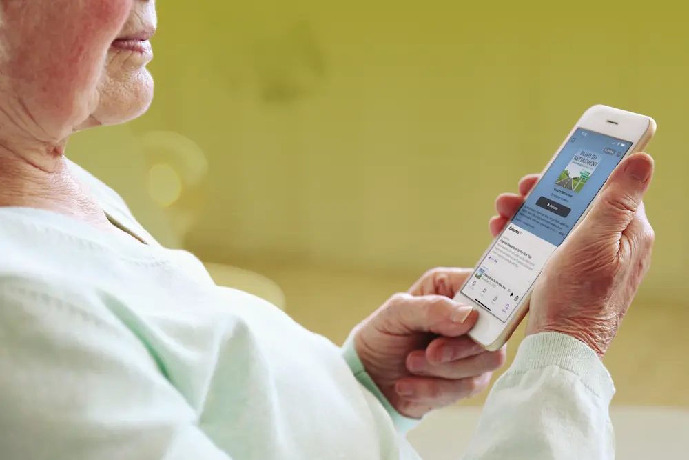 AdobeStock_287422803_senior woman looking at cell phone